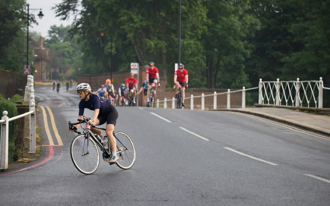Group cycling event symbolizing family sponsorship and community engagement in outdoor activities.