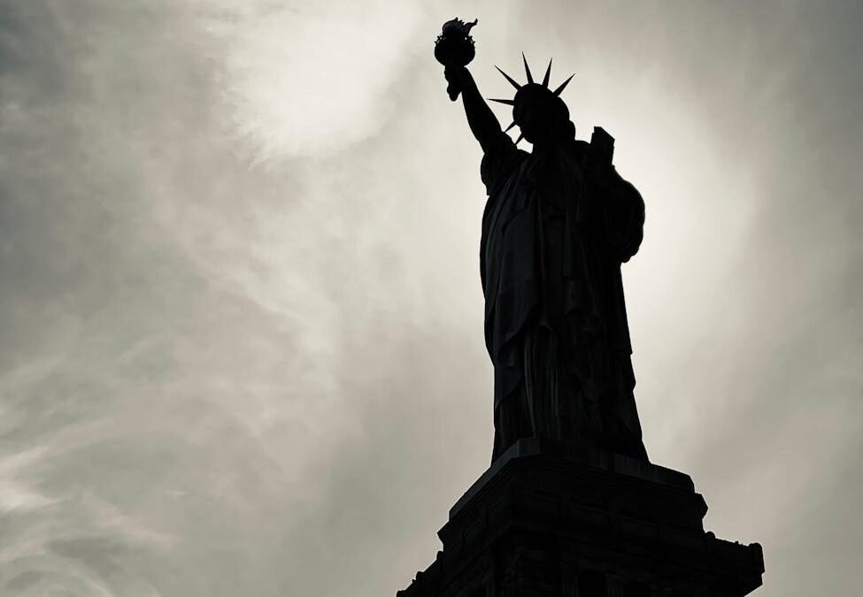 Silhouette of the Statue of Liberty symbolizing hope for immigrants.
