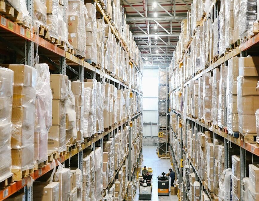 View of organized warehouse shelves, essential for Canada procurement logistics and supply chain management.