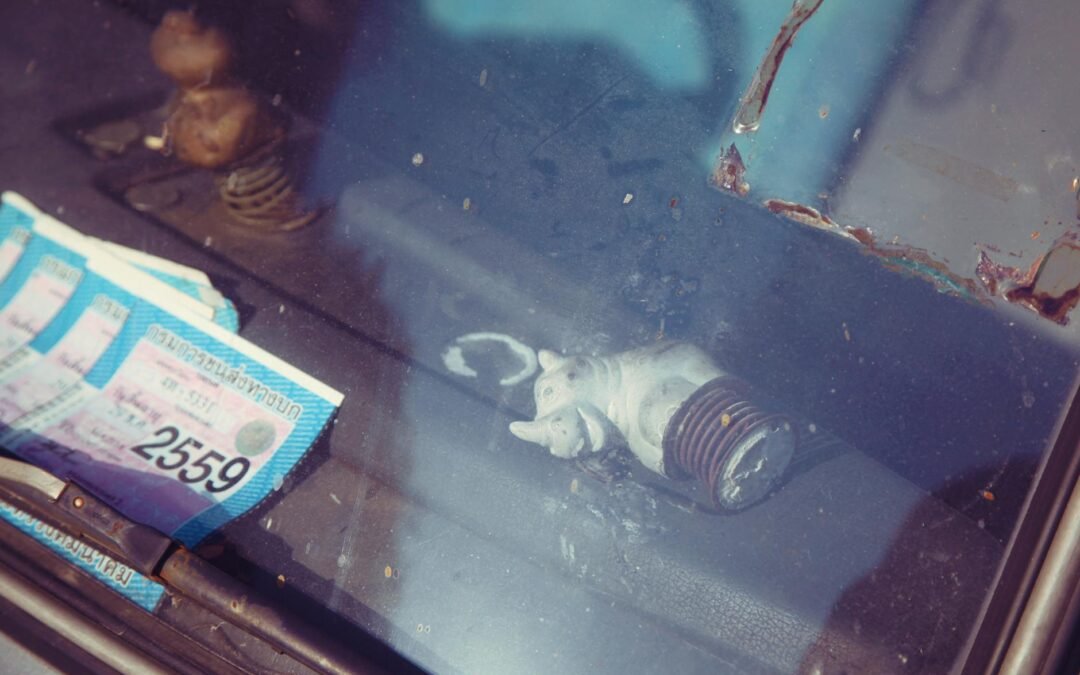 Work permit documents placed on a car dashboard, highlighting organization for job seekers.
