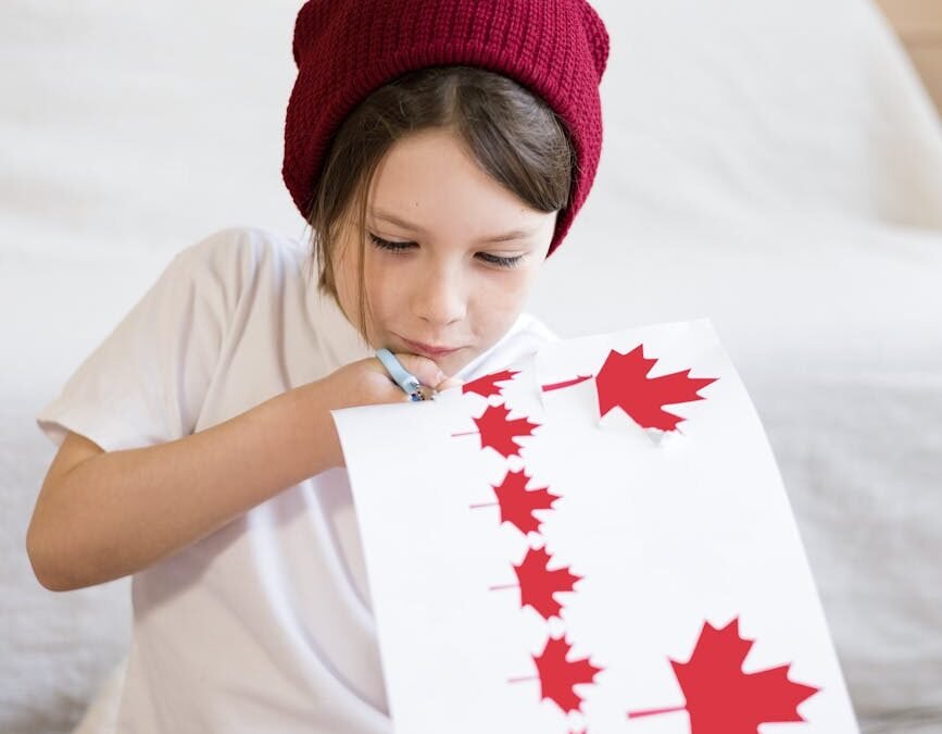 Child crafting a Canadian flag, representing creativity in Canadian education benefits.