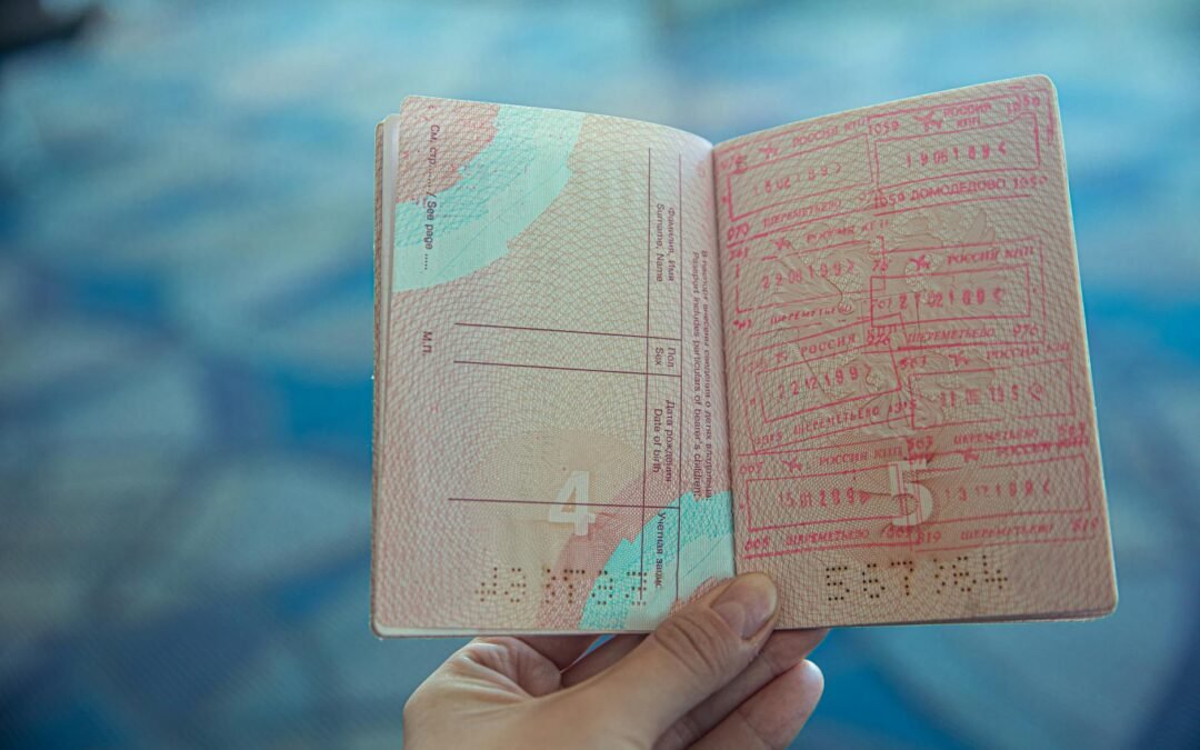 Open passport highlighting immigration pages, symbolizing essential immigration services and travel.