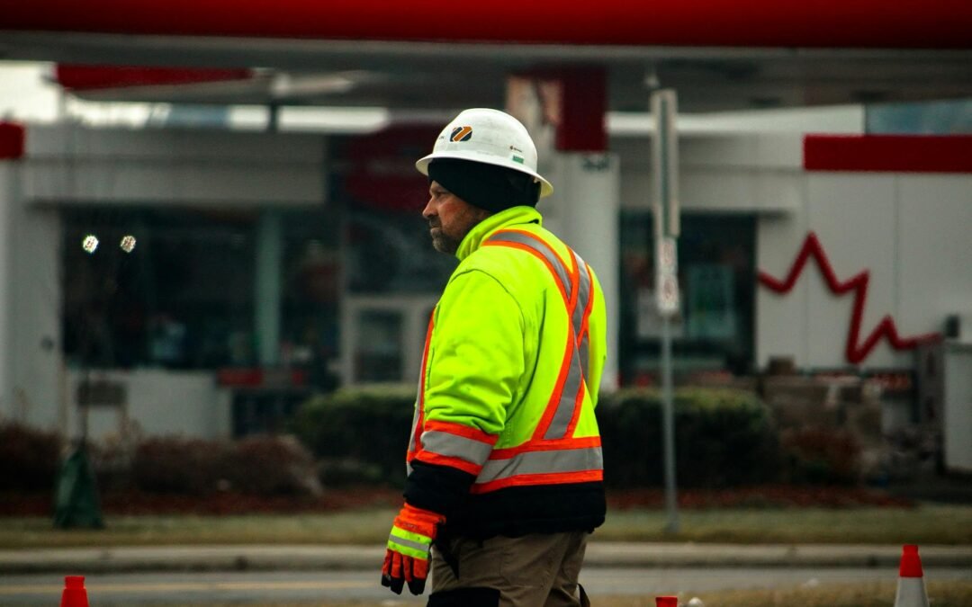 Construction worker in reflective gear, emphasizing the need for Canada work permits.