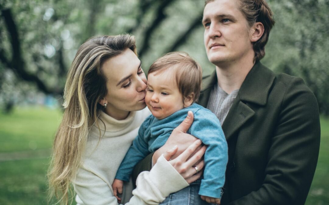 Family enjoying a joyful reunion in nature, sharing love and connection with their child.