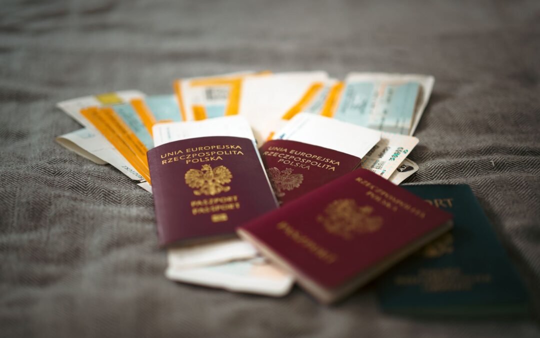 Stack of passports and documents related to immigration consultancy services.