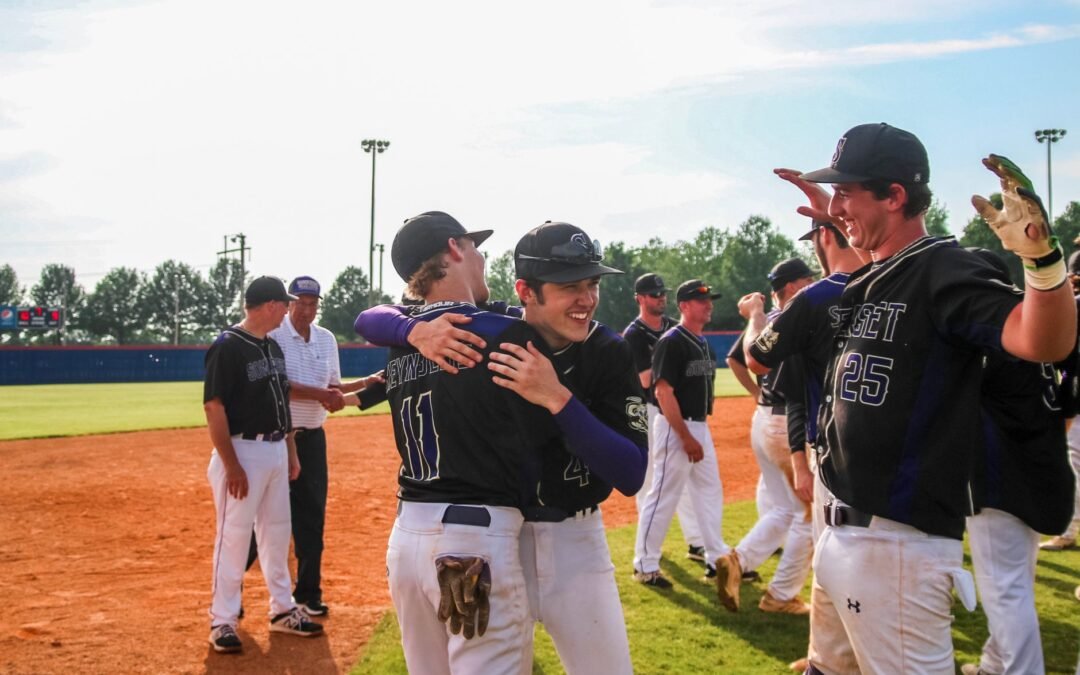 Youth baseball players celebrating a victory, highlighting community engagement in Northeast BC RCIP.